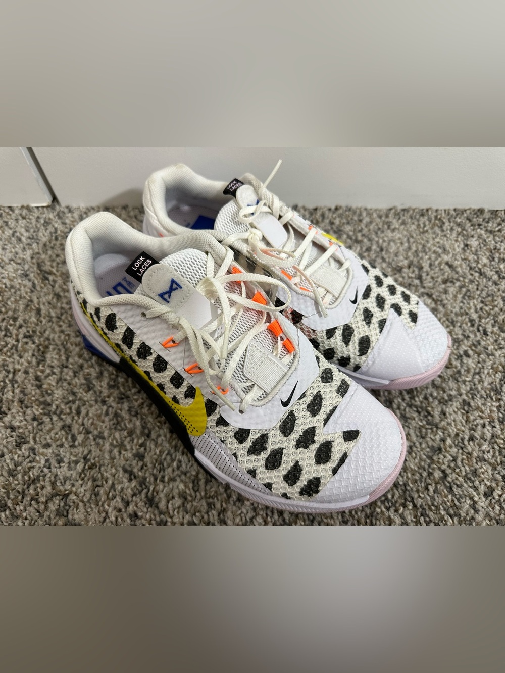 Nike Womens White Metcons with Yellow Swoosh and Black Spot Pattern